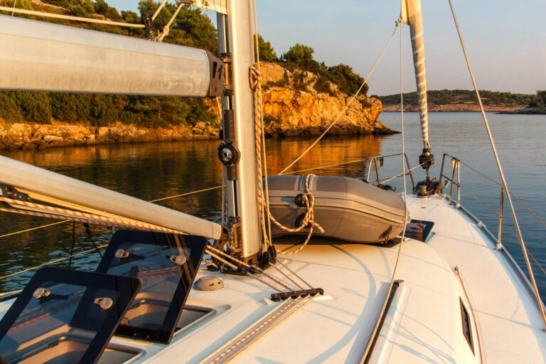 Evening on a yacht in the bay. Evening light on the sea. Sailing holidays in Croatia. Romance of yachting. Sunset on the yacht.